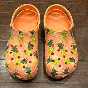 CROCS pineapple and papaya color patter in excellent condition brand new!